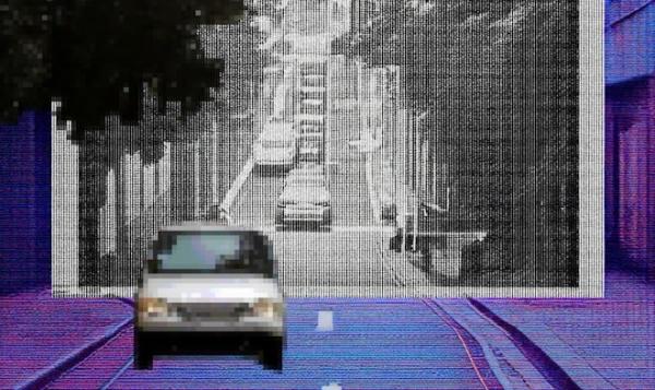 A car traveling down a street background a cityscape in the distance partially in black and white frame