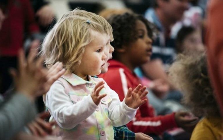 Image of Audience of children clapping