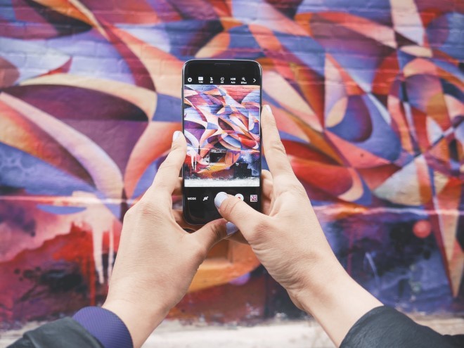Image of iphone photographing graffiti