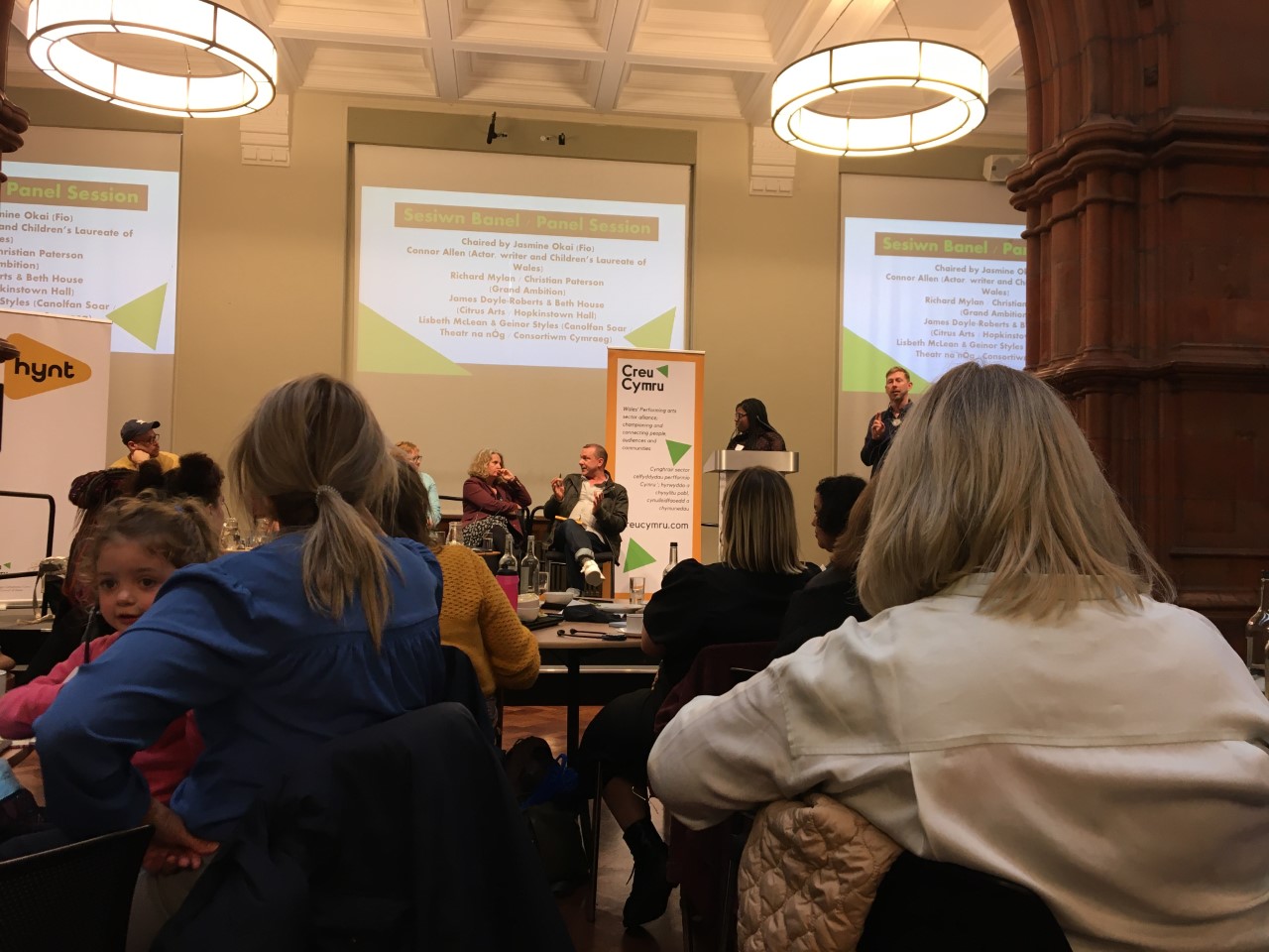 Attendees listening to speakers at Creu Cymra 2022