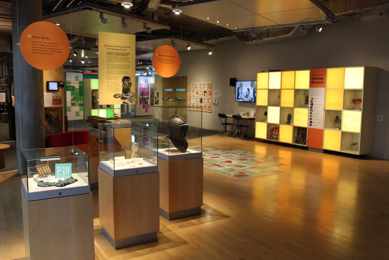 An interior of a museum with bright displays