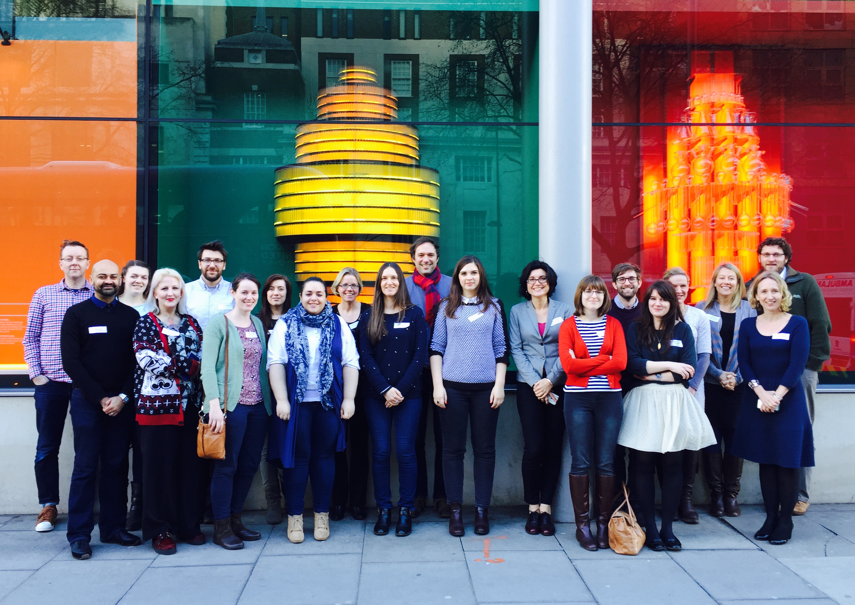 A group of people against a colourful background