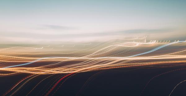 Image of yellow and white lights streaks on a blurred background