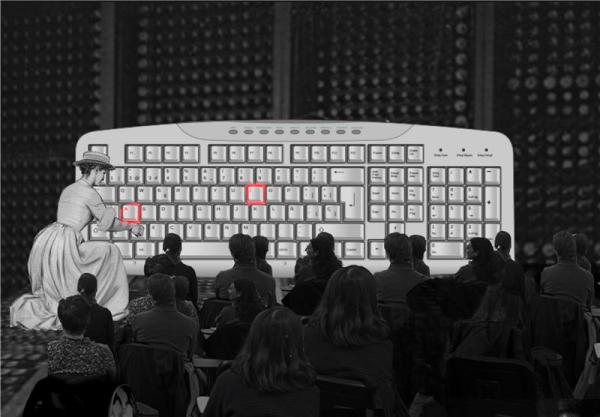 A woman is positioned in front of a computer keyboard, engaged in typing.
