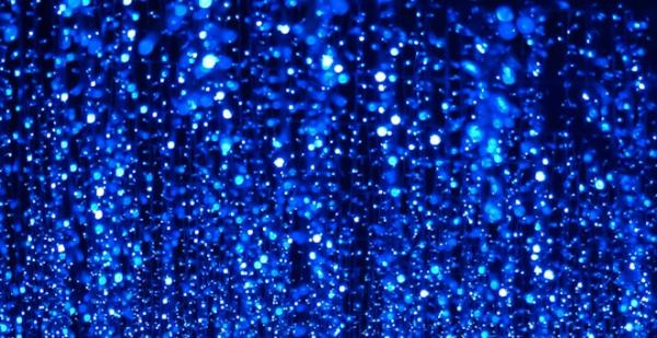 Blue sparkly lights on a dark background