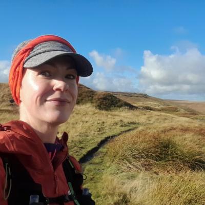 Alice Kershaw headshot on top of a hill